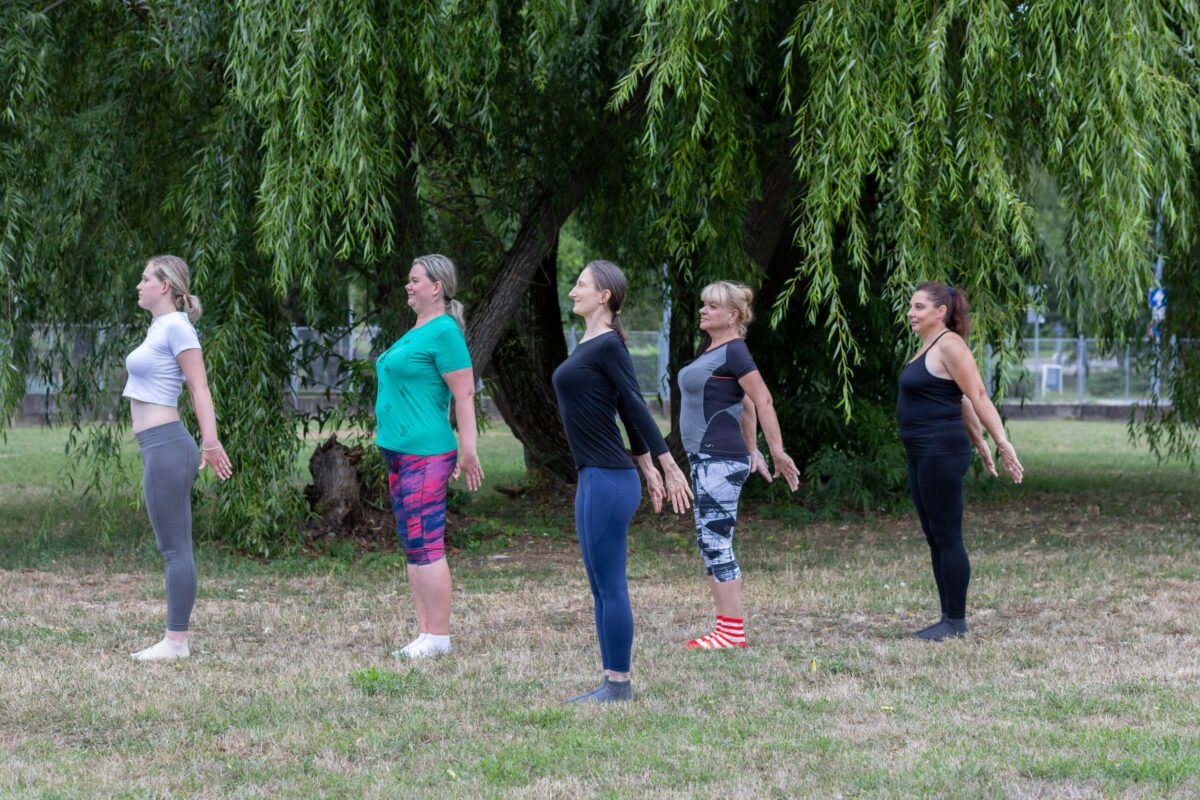 Certified Aviva Method Instructor at Vitality Flame leading a small group Aviva Method session, guiding women through coordinated reproductive health exercises that ease menstrual cramps, reduce PMS, and perimenopause symptoms.