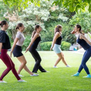 Certified Aviva Method Instructor leading rhythmic cardio dance movements designed to increase energy, improve mood, and ease PMS.